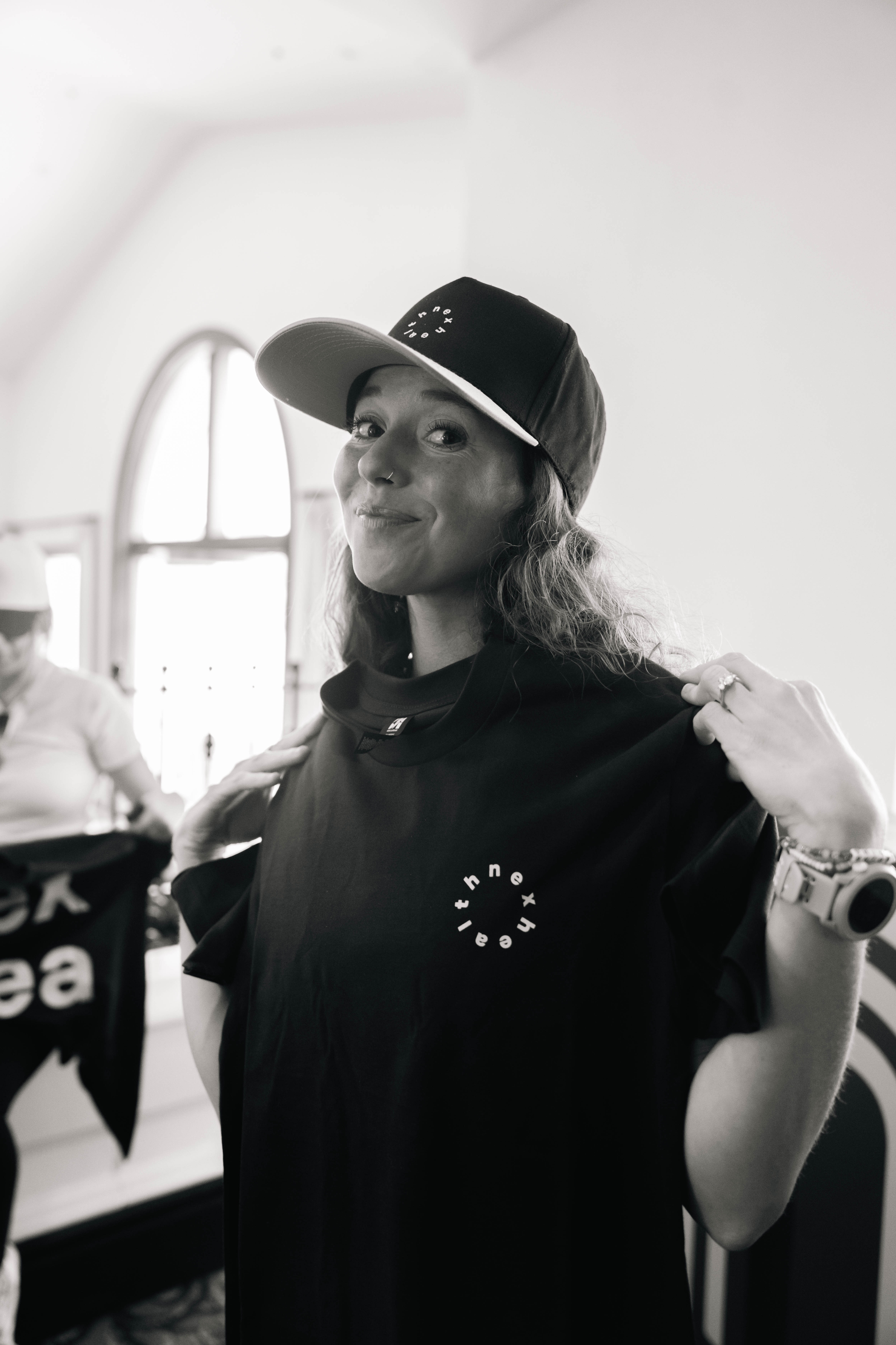 man walking in front of textured wall